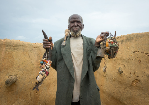 Benin, West Africa, Boukoumbé, mr kouagou maxon showing his voodoo magic healer fetishes
