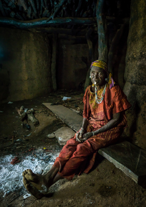 Togo, West Africa, Nadoba, old woman inside a traditional tata somba house