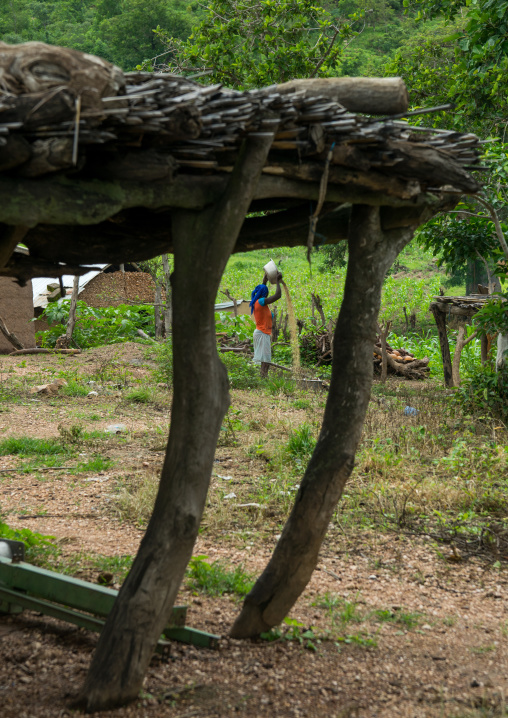 Togo, West Africa, Nadoba, somba tribe woman separating grain from chaff by wind winnowing