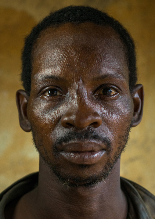 Benin, West Africa, Koussou, a somba tribe man with his face covered with linear scars