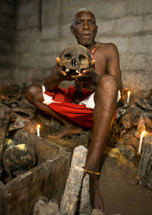 Benin, West Africa, Bopa, dah tofa voodoo master showing the skulls criminals killed by heviosso the god of thunder that he collects