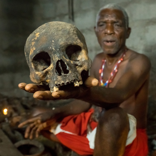 Benin, West Africa, Bopa, dah tofa voodoo master showing the skulls criminals killed by heviosso the god of thunder that he collects