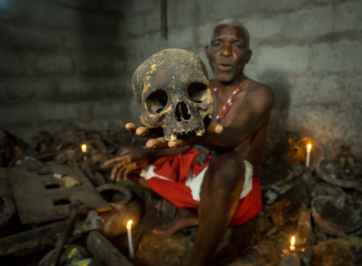 Benin, West Africa, Bopa, dah tofa voodoo master showing the skulls criminals killed by heviosso the god of thunder that he collects