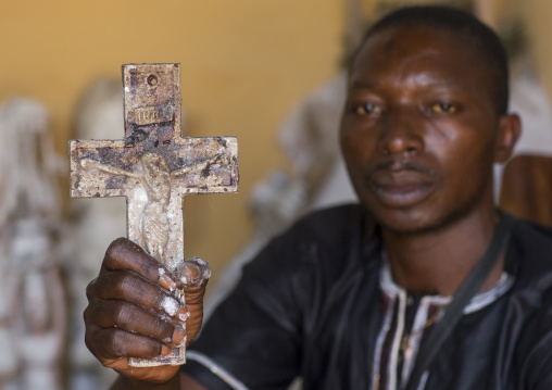 Benin, West Africa, Bonhicon, kagbanon bebe priest holding a crucifix during a voodoo ceremony