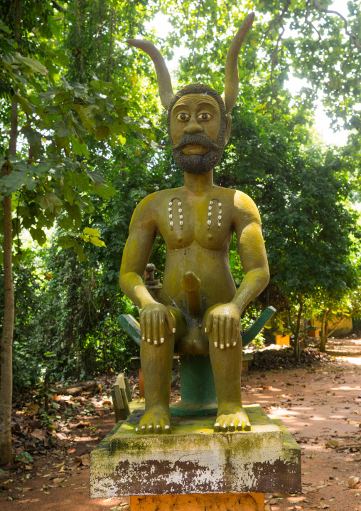 Benin, West Africa, Ouidah, statue of phallic and horned voodoo deity in kpasse sacred forest