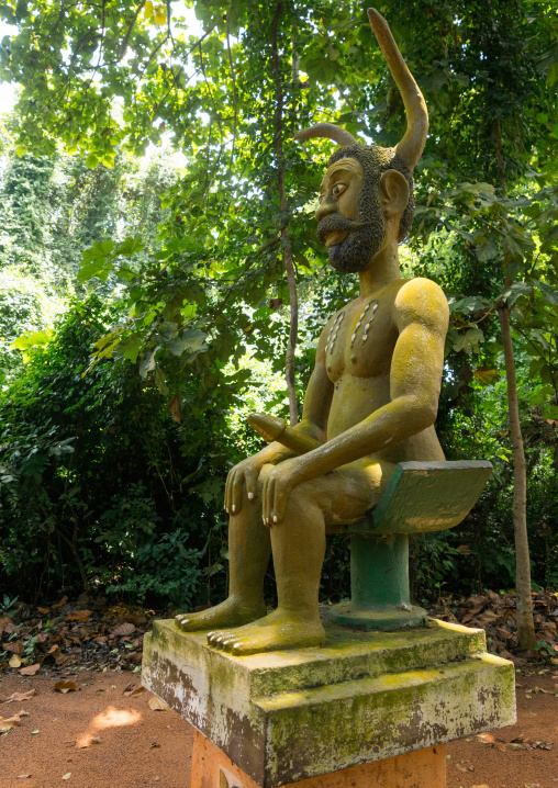Benin, West Africa, Ouidah, statue of phallic and horned voodoo deity in kpasse sacred forest