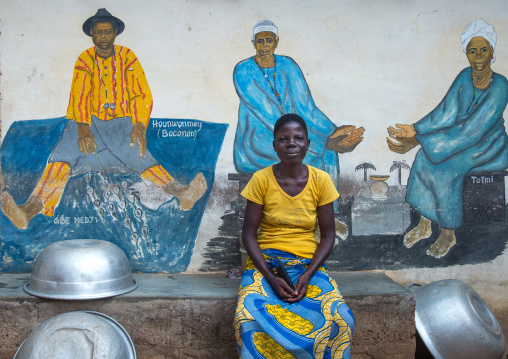 Benin, West Africa, Savalou, a priestess from the voodoo covent of the royal palace in front of a painted wall