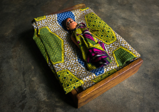 Benin, West Africa, Ouidah, carved wooden figure of a dead twin sleeping on his bed