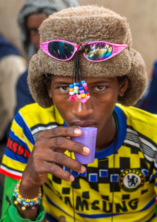 Benin, West Africa, Copargo, young fulani peul tribe man with colorful and fashionable clothes