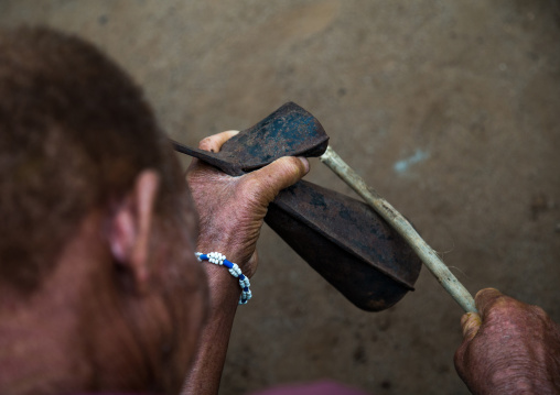 Benin, West Africa, Bopa, man with a bell during a voodoo ceremony
