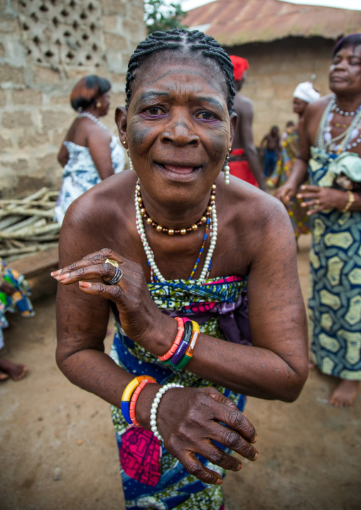 Benin, West Africa, Bopa, voodoo priestess with tattooed face dancing during a ceremony