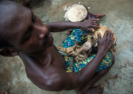 Benin, West Africa, Bopa, drummer during a voodoo ceremony