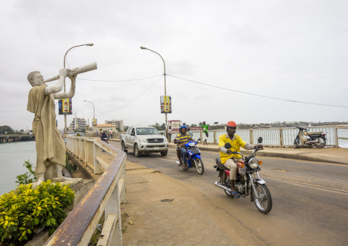 Benin, West Africa, Cotonou, motos and cars passing on the bridge over nokoue lake