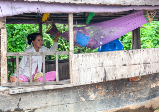 Cambodian mother with her baby in a hammock in the floating village on Tonle Sap lake, Siem Reap Province, Chong Kneas, Cambodia