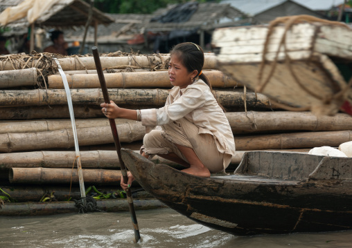 Cambodian girl on a boat in the floating village on Tonle Sap lake, Siem Reap Province, Chong Kneas, Cambodia