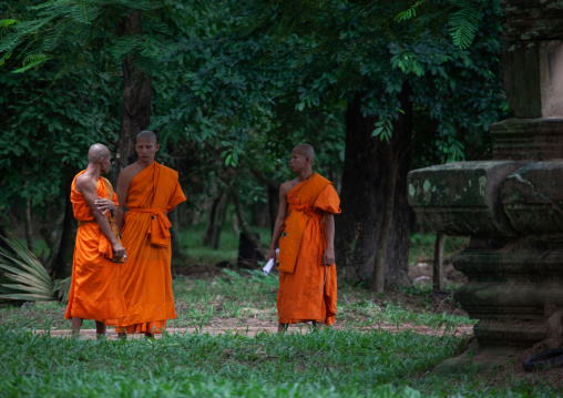 Monks in a garden in Angkor wat, Siem Reap Province, Angkor, Cambodia