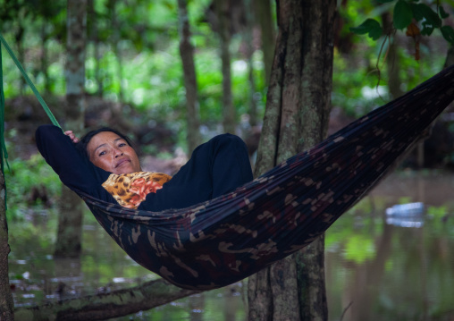 Cambodian woman resting in a hammock, Siem Reap Province, Angkor, Cambodia