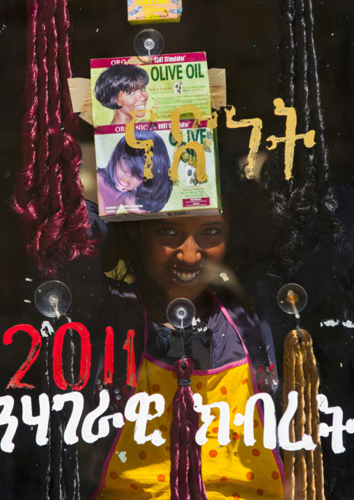 Girl Standing Behind The Glass Of A Hairdresser, Debub, Adi Keyh, Eritrea