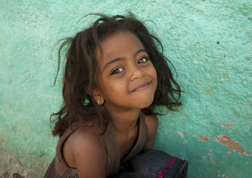 Portrait Of A Smiling Kid With Wild Hair In Harar, Ethiopia
