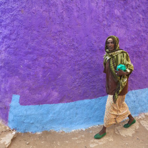 Woman Passing By A Purple Painted Wall, Harar, Ethiopia