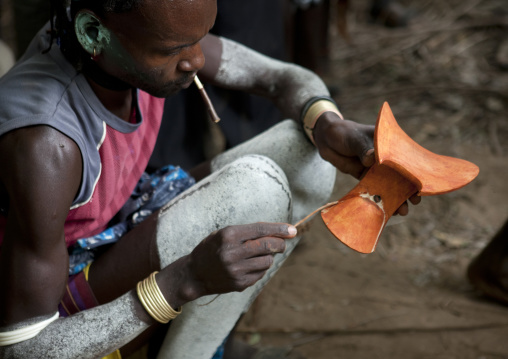 Whipper Painting His Headrest During Bull Jumping Ceremony In Hamer Tribe, Omo Valley, Ethiopia