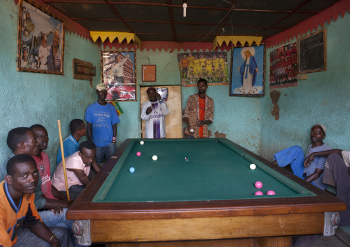 Men playing snooker pool indoors Ethiopia