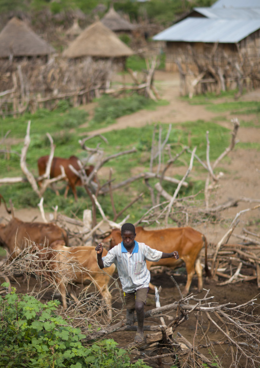 Young Konso Boy Climbing Up The Village Ethiopia