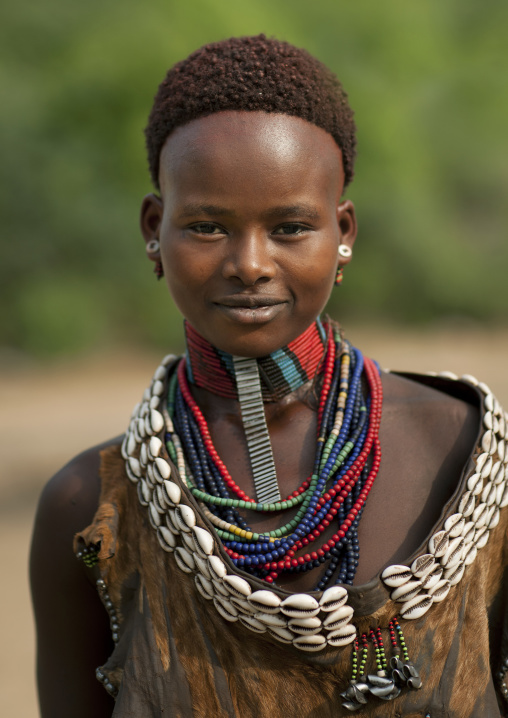 Portrait Of Beautiful Dark Eyed Hamer Woman Wearing Beaded Necklace  Omo Valley Ethiopia