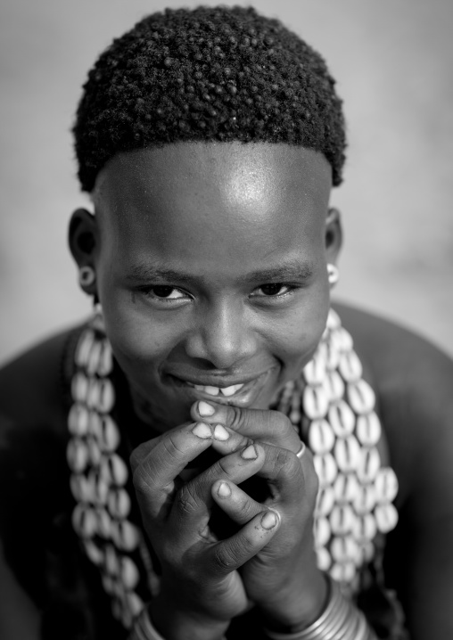 Portrait Of Beautiful Dark Eyed Hamer Woman Wearing Beaded Necklace  Omo Valley Ethiopia