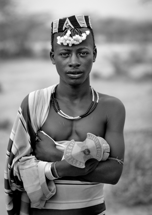 Hamer Man Dressed In Traditional Loincloth With Hat And Holding Headrest Omo Valley Ethiopia
