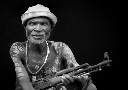 Senior Karo Man With Kalashnikov Rifle In Hand And Hat Ethiopia
