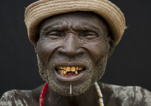 Portrait Of Senior Karo Man Yellow Teeth And Hat Ethiopia