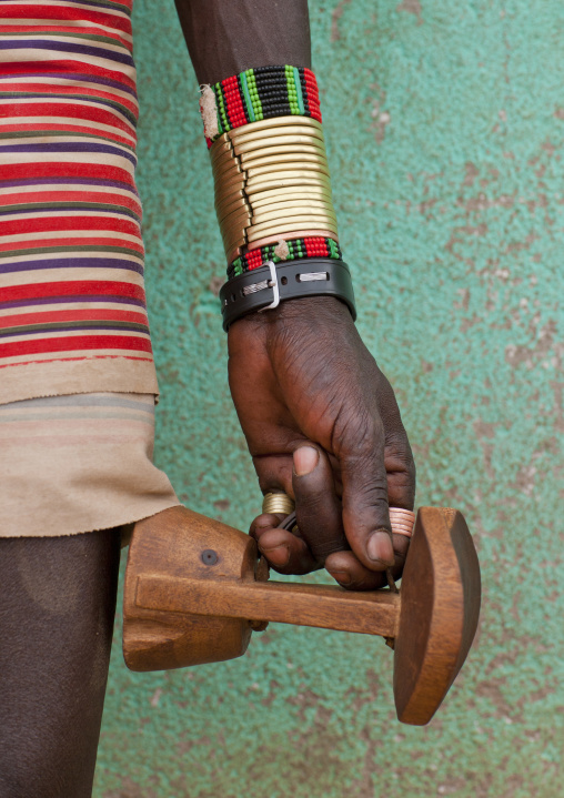 Detail Of Hamer Man Hand With Bracelets Carrying Wooden Carved Headrest Omo Valley Ethiopia