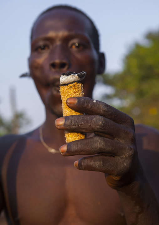 Majang Tribe Man Smoking For A Celebration, Kobown, Ethiopia