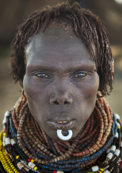Portrait Of A Nyangatom Tribe Woman With Chin Jewel, Omo Valley, Kangate, Ethiopia