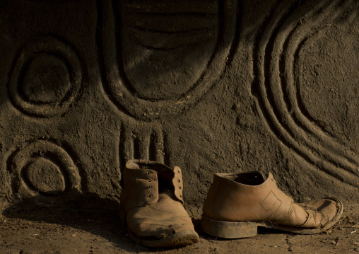 Old Shoes In Front Of An Anuak Traditional Hut In Abobo, The Former Anuak King Village, Gambela Region, Ethiopia