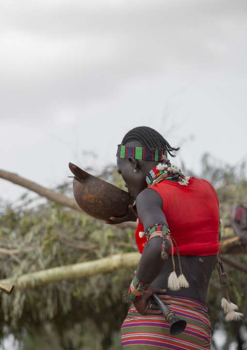 Bashada Tribe Woman Drinkinf Alcohol During A Bull Jumping Ceremony, Dimeka, Omo Valley, Ethiopia