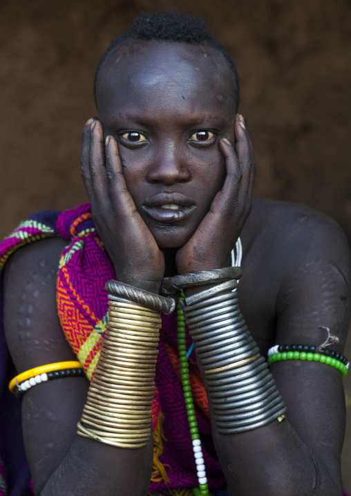 Portrait Of A Bodi Tribe Woman With Copper Bracelets, Hana Mursi, Omo Valley, Ethiopia