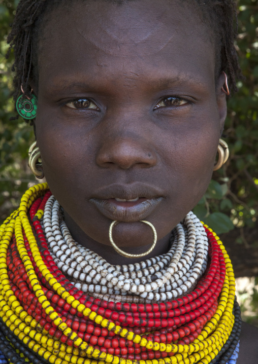 Portrait Of A Topossa Woman, With Traditional Clothes, Omo Valley, Kangate, Ethiopia
