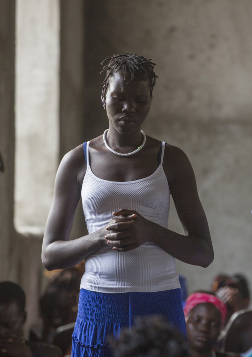 Woman Praying During Catholic Sunday Church Service, Gambela, Ethiopia
