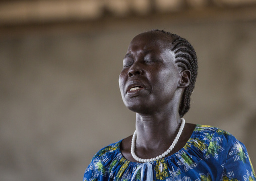 Woman Praying During Catholic Sunday Church Service, Gambela, Ethiopia
