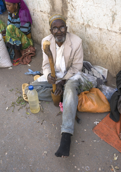 Old Man Without Teeth Crashing Some Qat In The Street, Harar, Ethiopia
