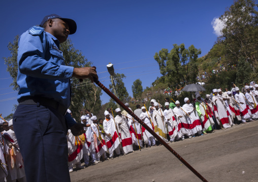 Ethiopian Policeman In Front Of The Priests Celebrating Timkat Epiphany Festival, Lalibela, Ethiopia