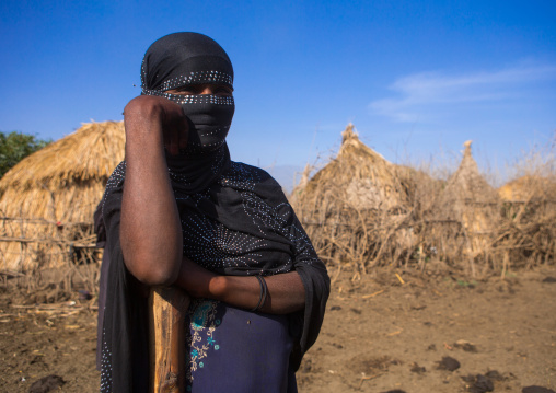 Portrait of an oromo woman with face covered, Amhara region, Artuma, Ethiopia