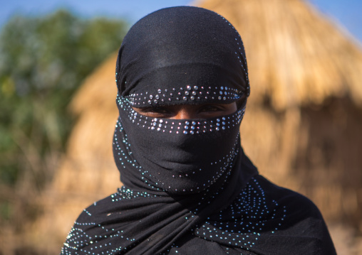 Portrait of an oromo woman with face covered, Amhara region, Artuma, Ethiopia
