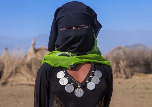 Portrait of an oromo woman with maria theresa thalers necklace, Amhara region, Artuma, Ethiopia