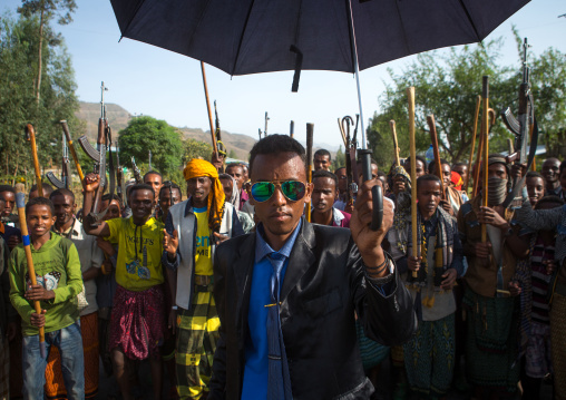Oromo groom with an umbrella during his wedding celebration, Oromo, Sambate, Ethiopia