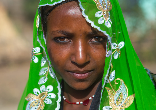 Portrait of an oromo woman with maria theresa thalers necklace, Oromo, Sambate, Ethiopia