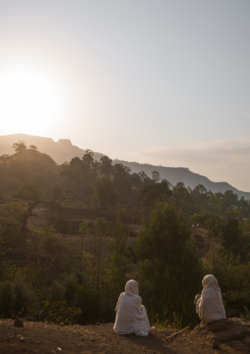 Ethiopian women resting on a hill, Amhara region, Lalibela, Ethiopia