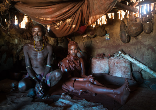 Hamer tribe teenage girl called a uta and her future stepfather who keeps her 6 months in a hut, Omo valley, Turmi, Ethiopia